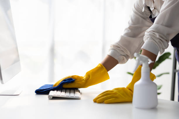 istock Young Asian cleaning woman uses a cloth to wipe clean a computer and keyboard using cleaning solution in her home office. 2183856080