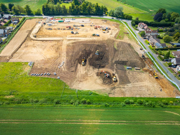 Large, early stages of a British housing development located on controversial green field space in East Anglia. stock photo