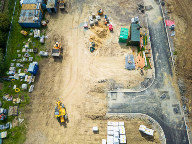 istock Aerial view of a low loader seen on a new housing development in the UK. 2183857957