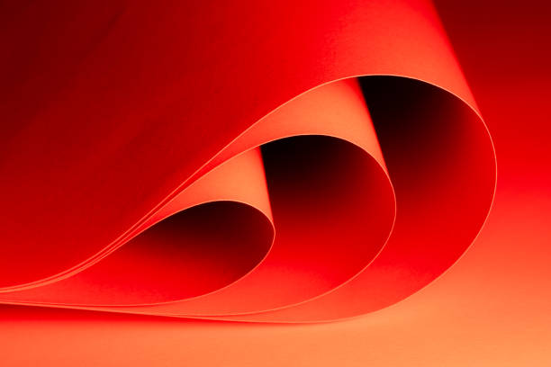 Curved shapes in vibrant red and orange blend together harmoniously, creating an engaging abstract composition that invites the viewer to explore textures and colors.
