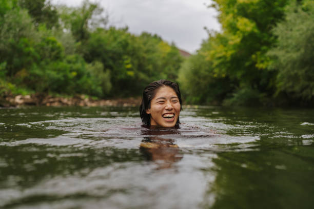 istock Triathlete swimming in the river 2183859460