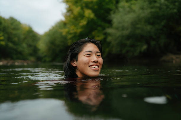 istock Triathlete swimming in the river 2183859484