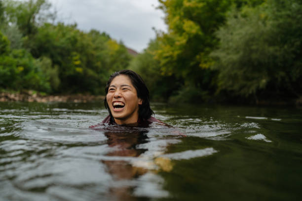 istock Triathlete swimming in the river 2183859490