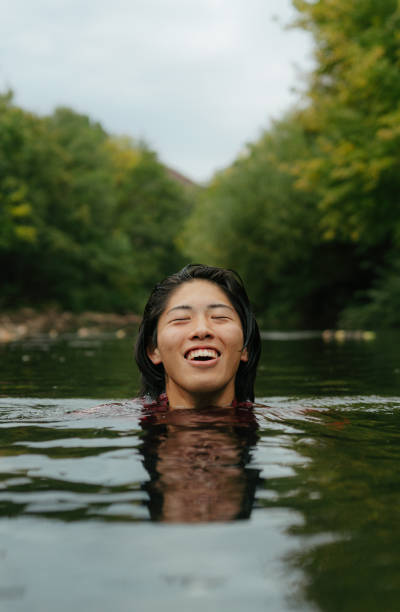 istock Triathlete swimming in the river 2183859492