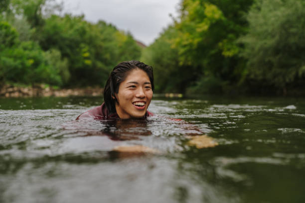 istock Triathlete swimming in the river 2183859522