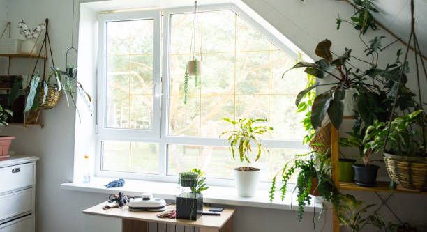 istock Window cleaning products are lying on the windowsill with a rag, spray, detergent, a robot cleaner. Spring cleaning in the house, cleaning service 2183861778