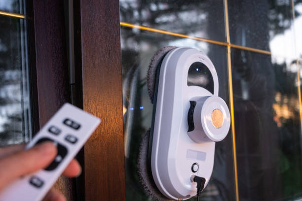 istock A window cleaner robot cleans windows in a house from the outside. Cleaning assistant, safe window cleaning, remote control 2183861816