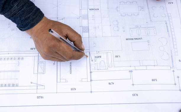 istock Close-up on an architect sketching on a blueprint 2183863052