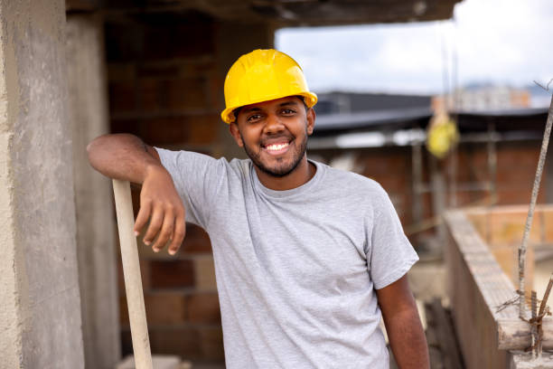 istock Portrait of a construction worker smiling at a building site 2183863086
