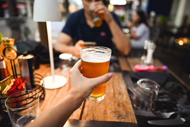 istock friends drinking and toasting beer 2183864979