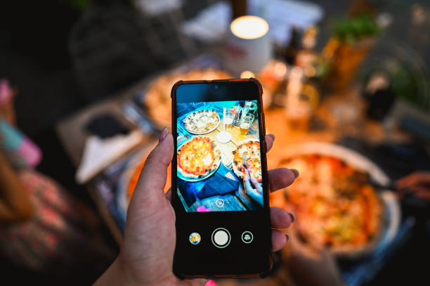 istock taking photos of delicious freshly pizza. 2183865018