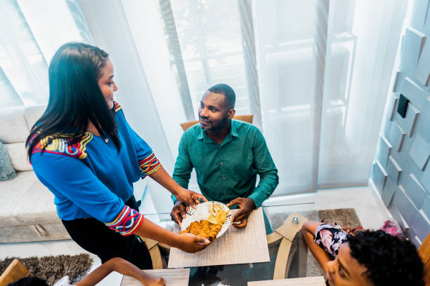 istock Wife serving lunch to husband at home 2183865867