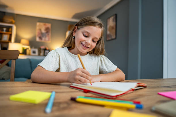 istock Girl doing homework at home 2183868934