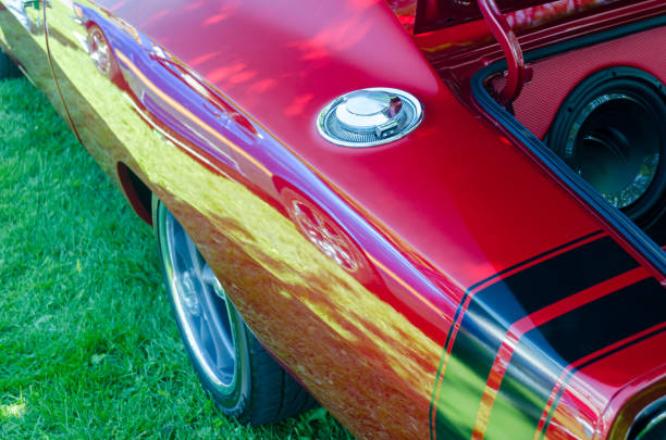 Cascais, Portugal 30 August 2015, Classic red ac cobra 427 roadster parked on a grassy field, possibly at a vintage car show or exhibition
