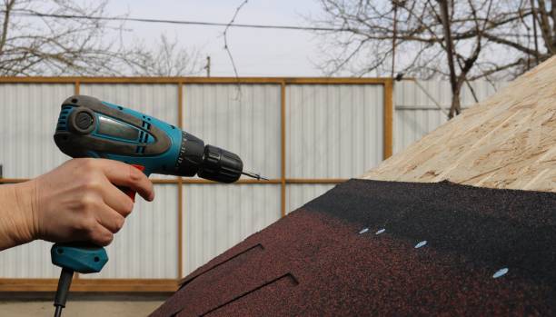 istock fixing soft tiles to a wooden surface with a self-tapping screw 2183875686