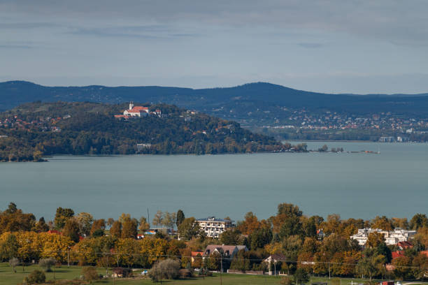 istock lake view with monastery and autumn trees 2183877567