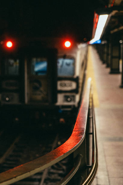 istock Nighttime subway station illuminated with striking red lights captivating scene 2183879078