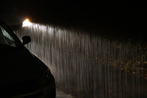 istock Heavy rain under headlight of vehicle at night 2183879300