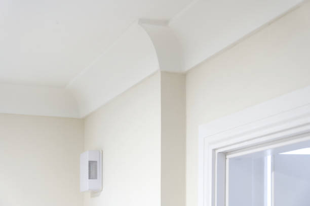 istock Coving installation painted white in new house 2183880094