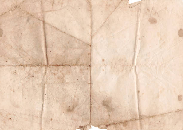 Folded Old Paper Texture Background. Brown crumpled and folded parchment vintage paper sheet with space for text