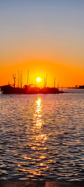istock October Sunset on the Water 2183883261