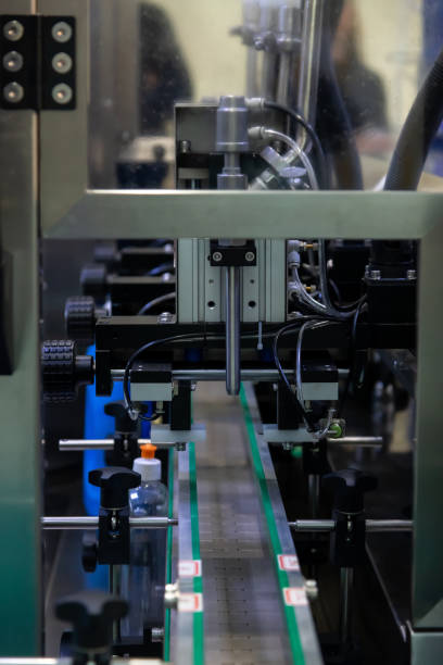 istock bottle filling machine on factory 2183888276