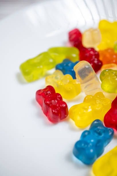 jelly beans bear shaped colorful candies on a blue background