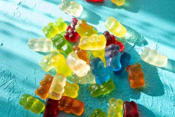 jelly beans bear shaped colorful candies on a blue background