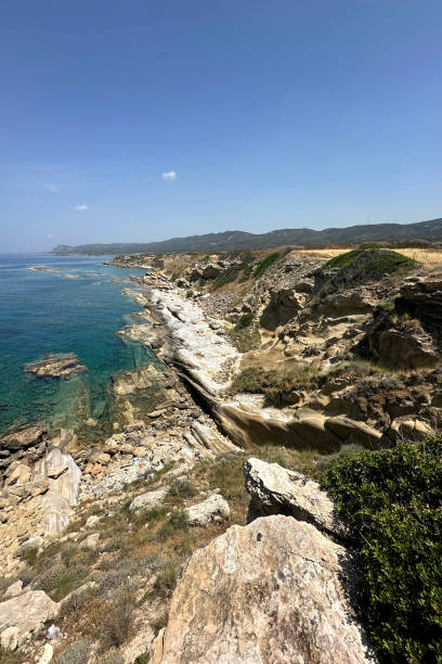 istock A stunning coastal landscape featuring rugged cliffs, clear turquoise waters, and lush greenery under a bright blue sky creates a tranquil atmosphere perfect for exploration 2183897502