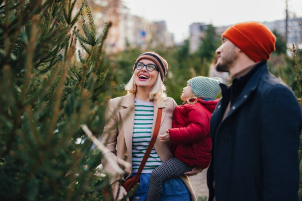 istock Joyful Family Choosing a Christmas Tree for the Holidays 2183898388