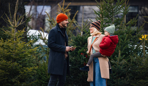 istock Family Choosing A Christmas Tree For New Year Celebrations 2183898433