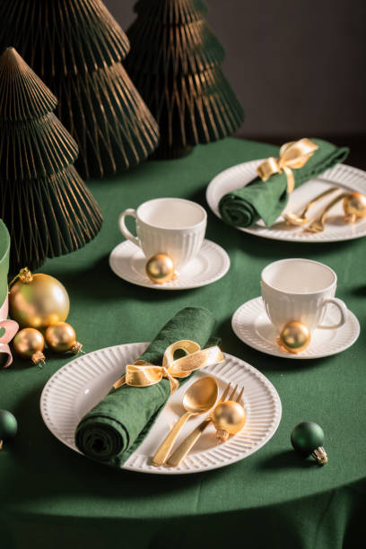 Unique green table set for Christmas with Christmas decorations.