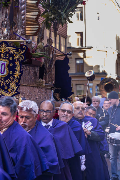 Stockholm, Sweden Oct 6, 2024 Men carrying a Jesus float at a  Peruvian culture and Catholic procession in the Sodermalm district to commemorate the El Senor de los Milagros tradition.