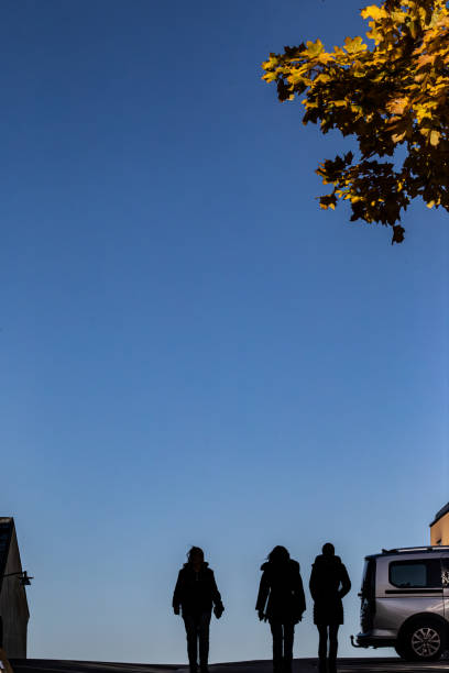 Stockholm, Sweden Oct. 15 2024 People walking in silhouette on Lilla Erstagatan on the Sodermalm island.