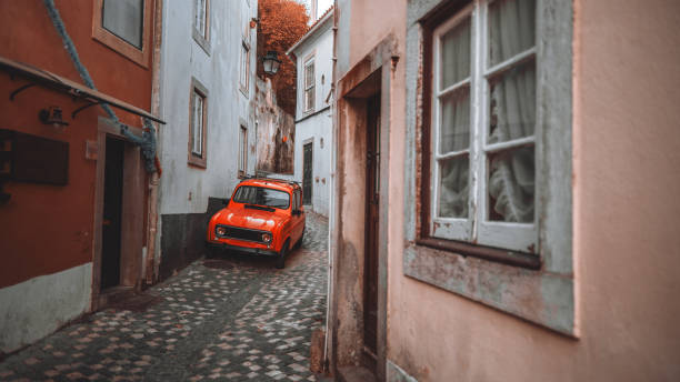 istock A red retro car in an old town 2183918210