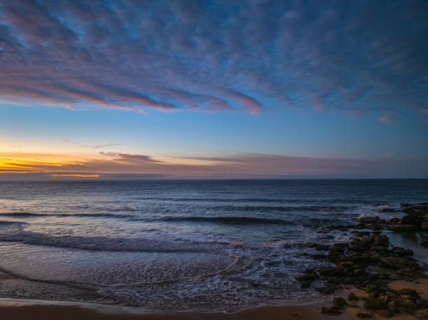istock Winter seascape views over the beach with high and medium cloud cover 2183924909