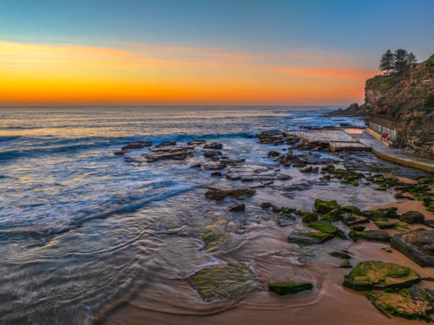 istock Sunrise at the Seaside with an Orange Horizon 2183924952