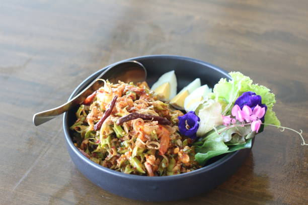 istock bowl of winged bean salad with spoon 2183929338