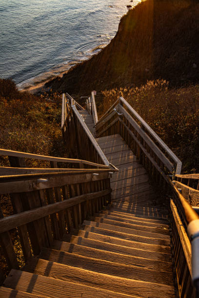 Stairs at Mohegan Bluffs, Block Island, RI Stairs to the beach at Mohegan Bluffs on Block Island, Rhode Island at sunset. mohegan-bluffs stock pictures, royalty-free photos & images
