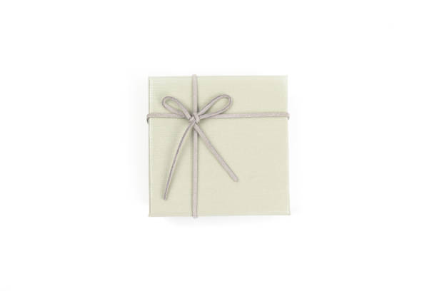 istock Top view, grey gift box tied with a bow isolated on white background. Gift box concept for a happy birthday, thank you, congratulation, mother's day, anniversary, Valentine's Day, or other holidays. 2183942828