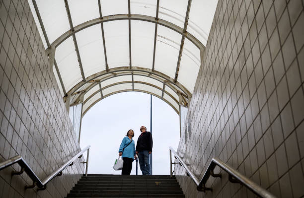 Two people looking up at the sky at the tunnel exit.