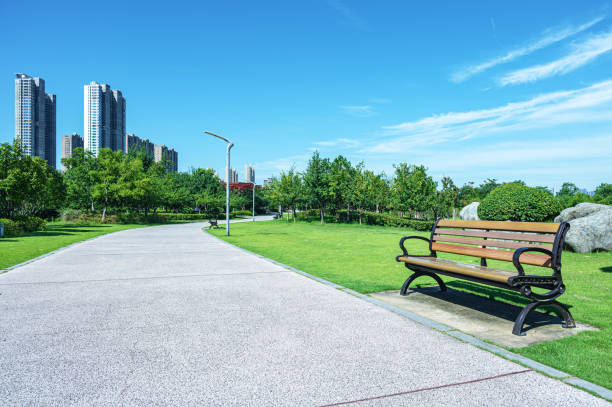 istock Curved footpath through the beautiful city park 2183945043