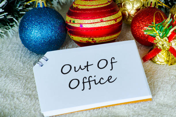 istock Out Of Office text on white notepad with Christmas decoration. Holiday season concept 2183946830