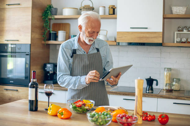 istock Senior Man using tablet to find a recipe 2183948437
