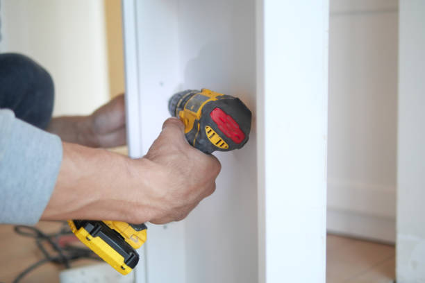 istock using electric drilling on white wooden board 2183954582
