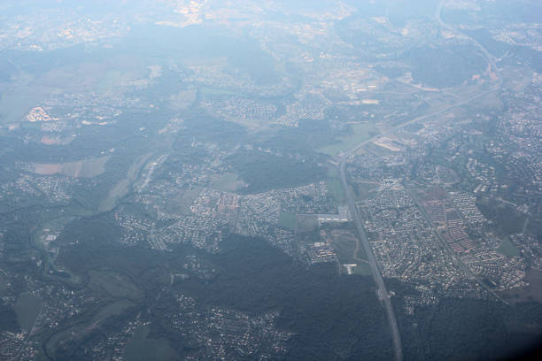 Views from the airplane window onto the landscapes of the earth beneath the wing.
