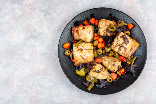 istock Roasted fish fillet and baked vegetables. 2183960478
