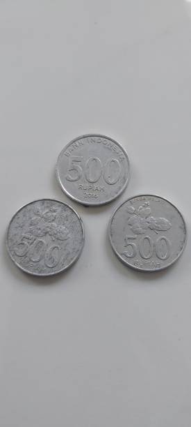 istock three coins in the 500 rupiah denomination on a white background 2183961298
