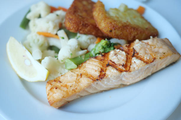 istock grill salmon served with fresh vegetables on a plate 2183962366