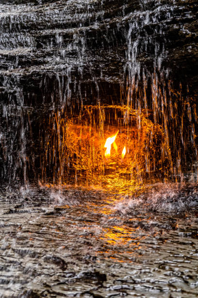 Water is flowing down a wall, creating a peaceful and calming atmosphere. Fountain with water cascade